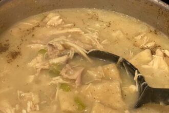 flat dumplings simmering in chicken broth